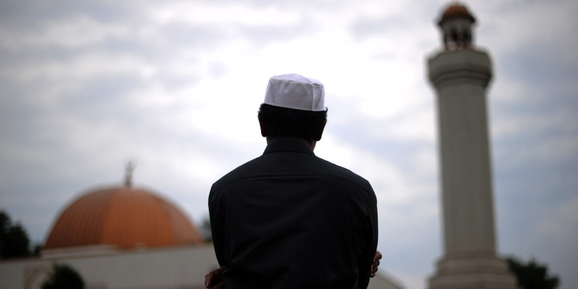 A Muslim takes part in a special morning prayer to start Eid-al-Fitr festival, marking the end of their holy fasting month of Ramadan, at a mosque in Silver Spring, Maryland, on August 19, 2012. Muslims in the US joined millions of others around the world to celebrate Eid-al-Fitr to mark the end of Ramadan with traditional day-long family festivities and feasting. AFP PHOTO/Jewel SAMAD        (Photo credit should read JEWEL SAMAD/AFP/GettyImages)