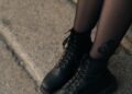 woman in black leather boots